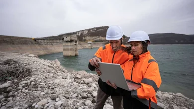 water technicians at a reservoir