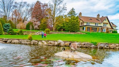 shore of a lake and house