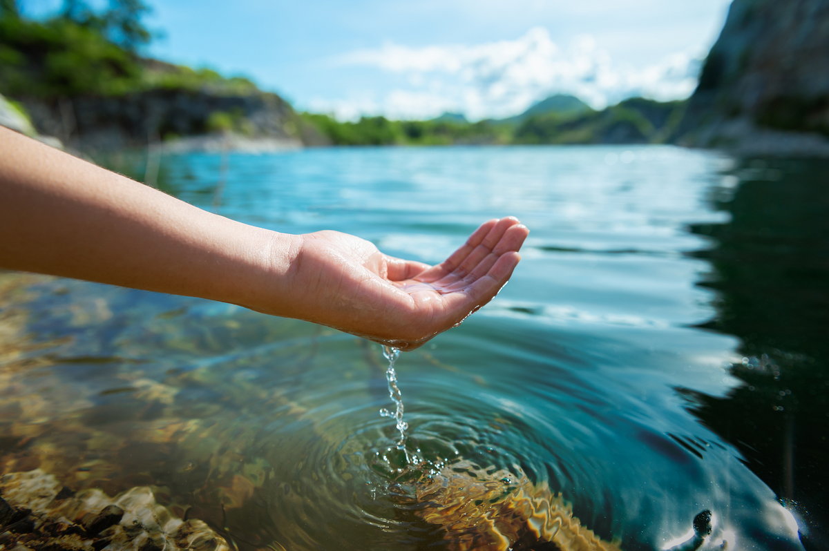 hand dipping into clean water