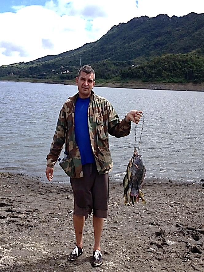 fisherman at restored lake