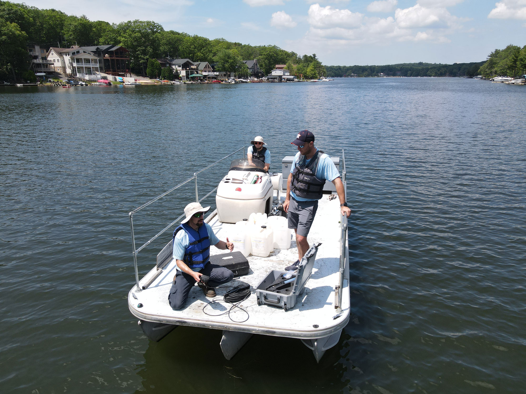 technicians taking an oxygen sample on Lake